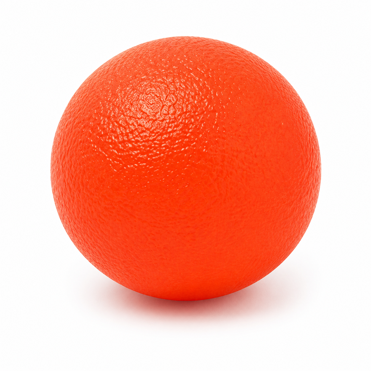 Detalle de textura antideslizante en pelota de fisioterapia roja, ideal para agarre seguro en ejercicios terapéuticos